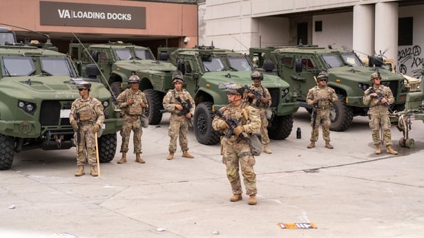 National Guard soldiers outside the Edward R. Roybal Federal Building in Los Angeles, California, US, on Sunday, June 8, 2025. The deployment of National Guard troops by President Donald Trump over the weekend, despite the objections of state and city officials, led to growing friction between local