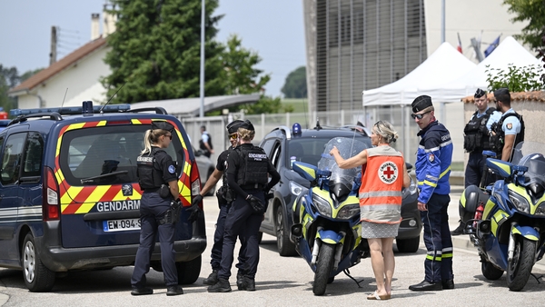 French gendarmes control the access to a secondary school after a 31-year-old teaching assistant was stabbed with a knife by a 15-year-old pupil during a bag search in Nogent, eastern France, on June 10, 2025. The teaching assistant, who died of her wound