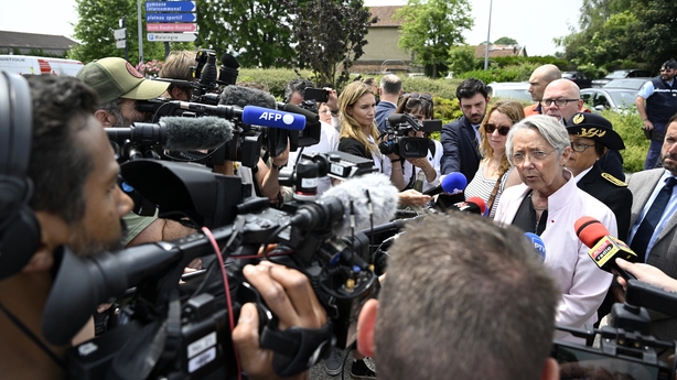 France's Minister of Education, Higher Education and Research Elisabeth Borne addresses journalists upon her arrival at the secondary school where a 31-year-old teaching assistant was stabbed with a knife by a 15-year-old pupil during a bag search in Nogent, eastern France, on June 10, 2025. The tea
