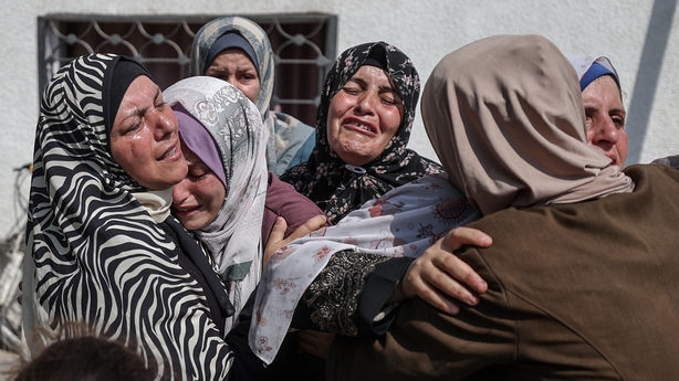 GAZA CITY, GAZA - JUNE 10: Relatives and loved ones of Palestinians, who lost their lives in Israeli attacks while they were in the Netzarim area, where U.S. humanitarian aid points were located, mourn as they attend their funeral ceremony at Shifa Hospital in Gaza on June 10, 2025. Israeli army tar