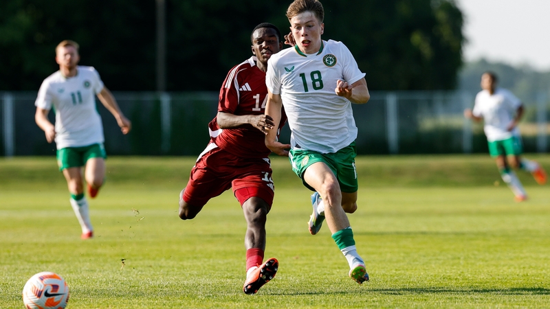 Republic of Ireland's Cathal O'Sullivan is challenged by Ahmed Reyad A Fadlelmula of Qatar