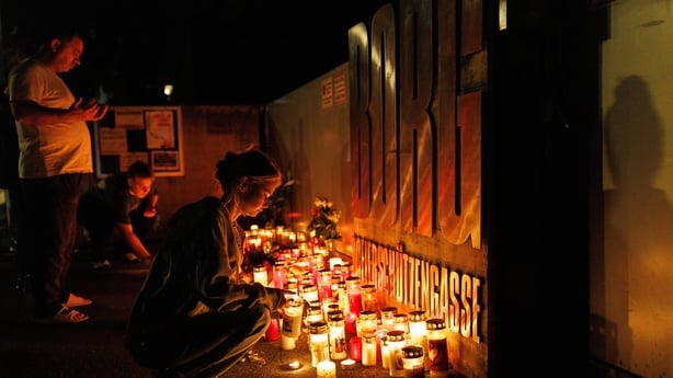 GRAZ, AUSTRIA - JUNE 10: People light candles at the school on June 10, 2025 in Graz, Austria. Austrian authorities have confirmed that eleven people died and eleven more are being treated for injuries, following a shooting at BORG Dreierschutzengasse secondary school on Tuesday. The 21-year-old sus