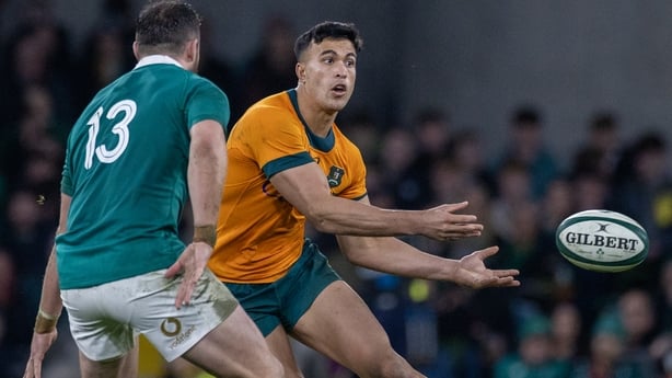 DUBLIN, IRELAND: NOVEMBER 30: Joseph Suaalii #13 of Australia makes a pass defended by Robbie Henshaw #13 of Ireland during the Ireland V Australia, Autumn Nations Cup rugby match at Aviva Stadium on November 30th, 2024, in Dublin, Ireland. (Photo by Tim Clayton/Corbis via Getty Images)