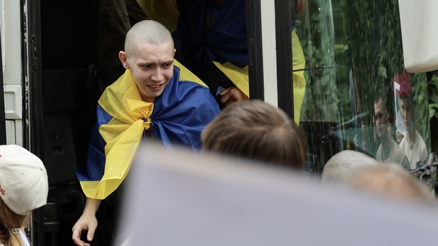 UNSPECIFIED, UKRAINE - JUNE 9: Ukrainian military personnel under the age of 25, released from Russian captivity during the 66th prisoner exchange, return to Ukraine on June 9, 2025 in Unspecified, Ukraine. Ukraine returned a group of military personnel under the age of 25, most held in Russian capt