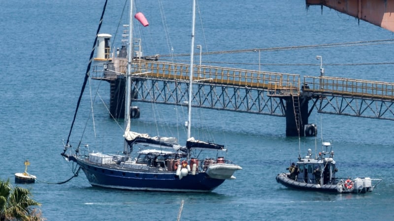 An Israeli police patrol boat moves near the Madleen as it is moored at the southern port of Ashdod