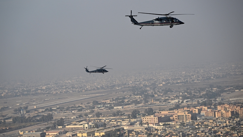 US State Department Black Hawk helicopters escort Secretary of State Antony Blinken as they fly over Baghdad last December