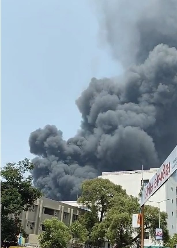 GUJARAT, INDIA - JUNE 12: Smoke rises after a plane crash shortly after takeoff from Sardar Vallabhbhai Patel International Airport in India's western state of Gujarat on June 12, 2025. The crash occurred in the Meghaninagar area, according to a report by the Press Trust of India, citing local autho