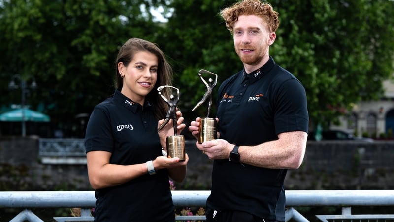 Waterford camóg Niamh Rockett (L) and Limerick hurler Cian Lynch with their awards