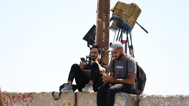 GAZA CITY, GAZA -JUNE 12: Press members try to cover latest developments in Gaza City after Internet and phone services collapsed across the Gaza Strip on June 12, 2025, following Israeli strikes on telecommunications infrastructure. The Palestinian authority accused Israel of deliberately targeting