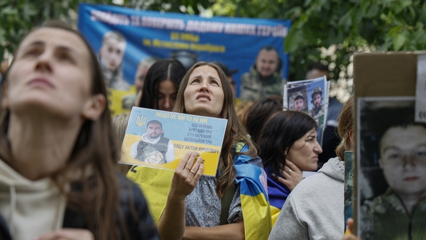 UNSPECIFIED, UKRAINE - JUNE 12: Families of Ukrainian POW's turn to those released during the 66th prisoner exchange, hoping to find out about their missed loved ones on June 12, 2025 in Unspecified, Ukraine. Ukraine has already returned the third group o