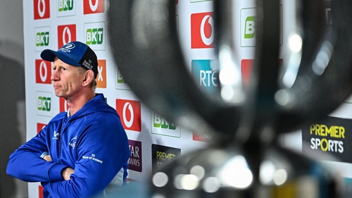 Leinster head coach Leo Cullen, alongside the URC trophy