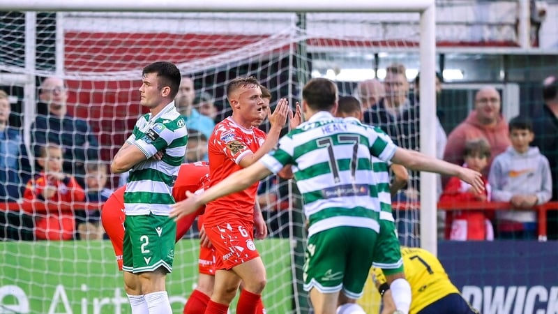Josh Honohan (L) with a pose after scoring the Shamrock Rovers winner