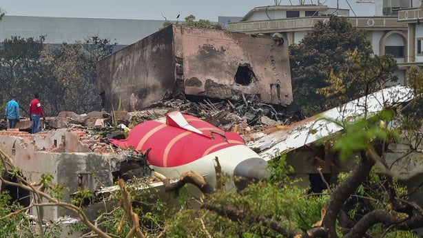 AHMEDABAD, INDIA - JUNE 13: Investigative officials stand near Debris of Air India Boeing 787 , crashed yesterday, on June 13, 2025 in Ahmedabad, India. An Air India Boeing 787 Dreamliner, flight AI-171, carrying 242 passengers and crew members en route from Ahmedabad to London Gatwick, crashed shor