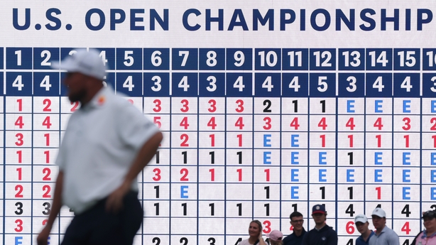 OAKMONT, PENNSYLVANIA - JUNE 13: A general view of the 18th hole leaderboard as Shane Lowry of Ireland looks on during the second round of the 125th U.S. OPEN at Oakmont Country Club on June 13, 2025 in Oakmont, Pennsylvania. (Photo by Patrick Smith/Getty Images)