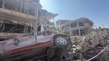 Israeli emergency personnel inspect damage caused by an Iranian missile strike on Ramat Gan
