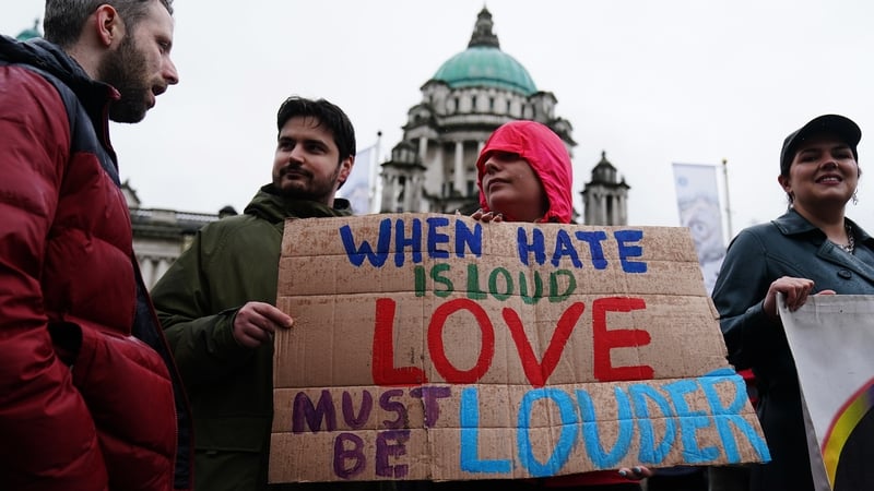 Demonstrators take part in a United Against Racism rally at Belfast City Hall