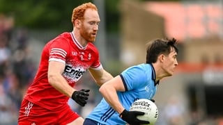 14 June 2025; Killian McGinnis of Dublin in action against Conor Glass of Derry during the GAA Football All-Ireland Senior Championship Round 3 match between Dublin and Derry at Páirc Esler in Newry, Down. Photo by Ramsey Cardy/Sportsfile
