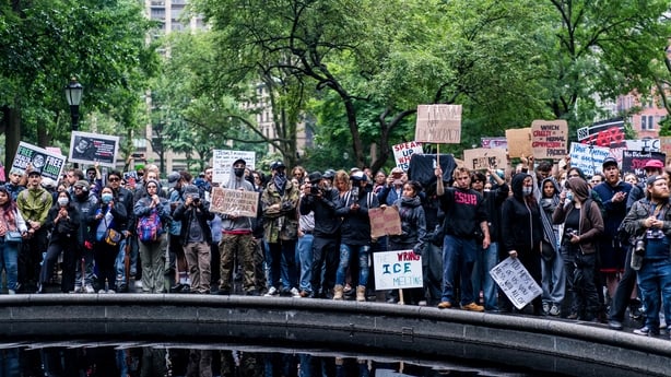 NEW YORK, UNITED STATES JUNE 14: Demonstrators gather in Manhattan's Washington Square Park as part of the "No Kings" march protesting President Donald Trump's planned military parade, on June 14, 2025. The crowd, carrying placards and flags, voiced opposition to what they described as authoritarian