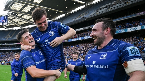 Luke McGrath (c) is lifted by Dan Sheehan after Leinster's win against the Bulls