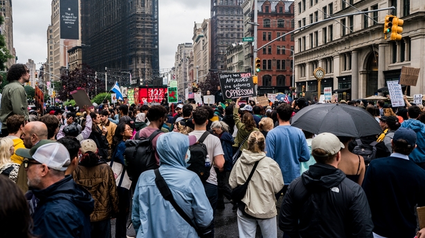 NEW YORK, UNITED STATES JUNE 14: Demonstrators gather in Manhattan's Washington Square Park as part of the "No Kings" march protesting President Donald Trump's planned military parade, on June 14, 2025. The crowd, carrying placards and flags, voiced opposition to what they described as authoritarian