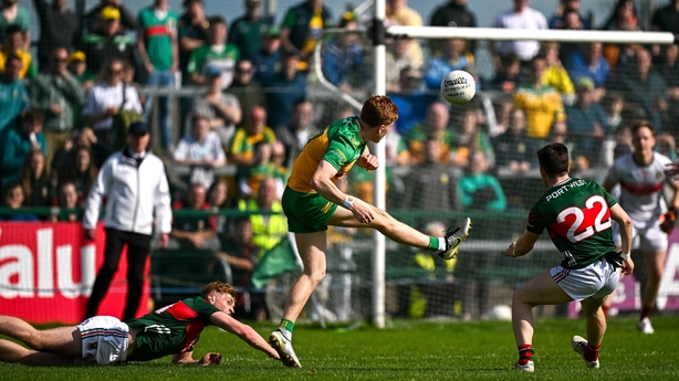 15 June 2025; Ciaran Moore of Donegal, centre, kicks his side's winning point after the full time buzzer during the GAA Football All-Ireland Senior Championship Round 3 match between Donegal and Mayo at King & Moffatt Dr Hyde Park in Roscommon. Photo by Seb Daly/Sportsfile