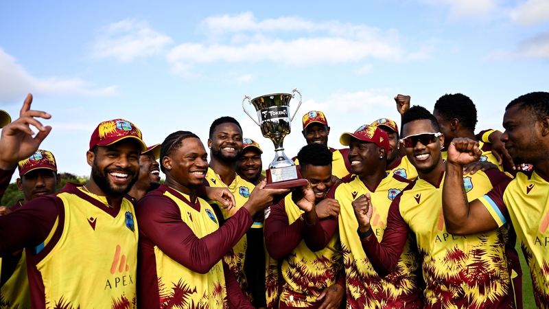 West Indies players celebrate with the trophy in Bready, Co Tyrone
