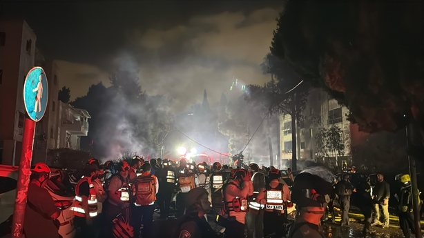 HAIFA, ISRAEL - JUNE 15: Emergency workers are on the scene as fire breaks out following a fresh wave of Iranian missile attacks in Haifa, Israel on June 15, 2025. Seven people were wounded in the northern city of Haifa. (Photo by Samir Abdalhade/Anadolu via Getty Images)