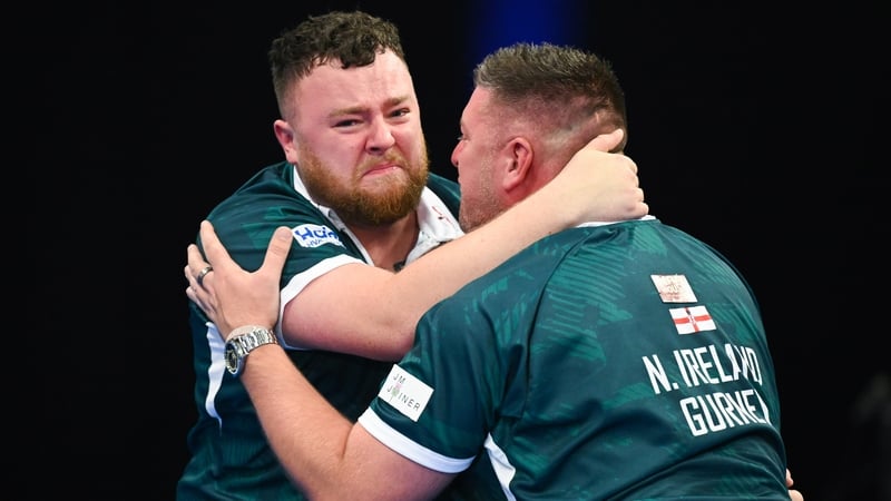 Josh Rock and Daryl Gurney embrace after winning the World Cup of Darts