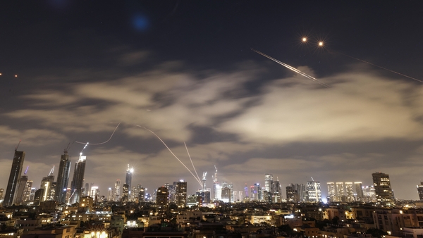 Israeli air defence systems are activated to intercept Iranian missiles over the Israeli city of Tel Aviv