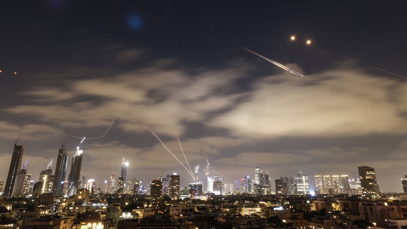 Israeli air defence systems are activated to intercept Iranian missiles over the Israeli city of Tel Aviv