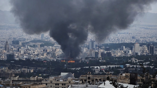 TEHRAN, IRAN - JUNE 16: Smoke rises after a reported Israeli strike on a building used by Islamic Republic of Iran News Network, part of Iran's state TV broadcaster, on June 16, 2025 in tehran, Iran. Over recent days, Iran has been hit by a series of Israeli airstrikes targeting military and nuclear