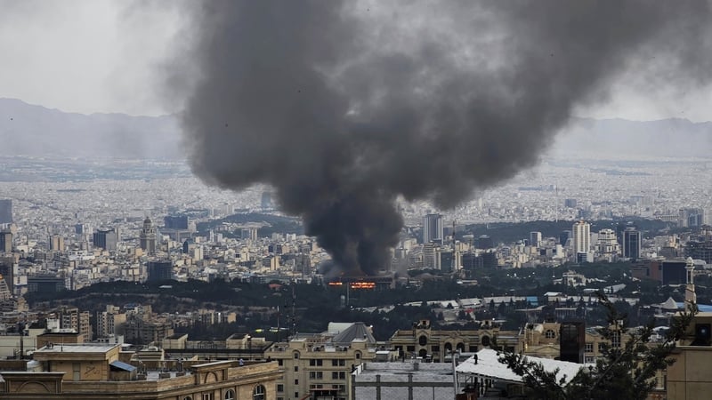 Smoke rises after a Israeli strike on a building used by Islamic Republic of Iran News Network