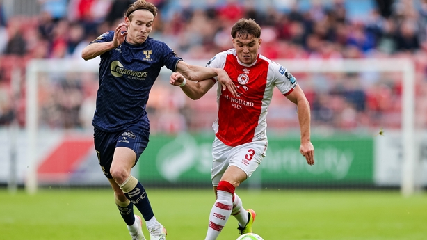 St. Patrick's Athletic's Anto Breslin holds off the challenge of Shelbourne's Harry Wood