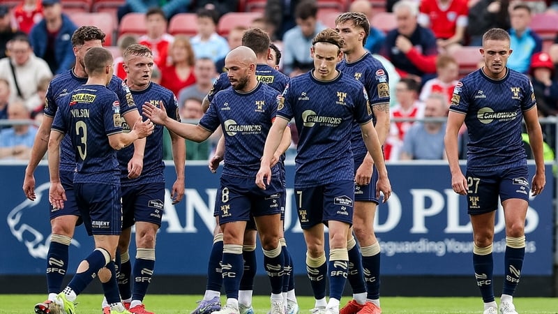 Shelbourne players celebrate their goal at Richmond Park, scored by Ali Coote