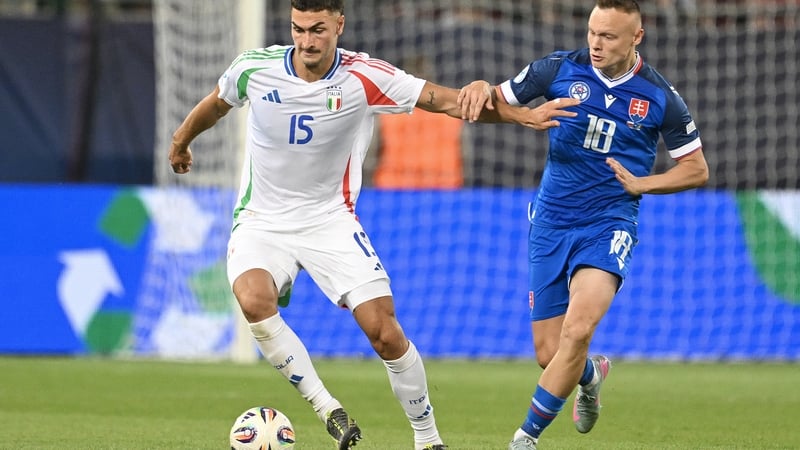 Diego Coppola (L) in action for Italy being against Slovakia at the UEFA European Under-21 Championship this week