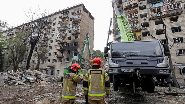 State Emergency Service employees search for people and clear the rubble after Russia directly hits a multi-story building with a strategic air-to-surface cruise missile with a cluster warhead at night in Kyiv, Ukraine, on June 17, 2025. The rescue operat