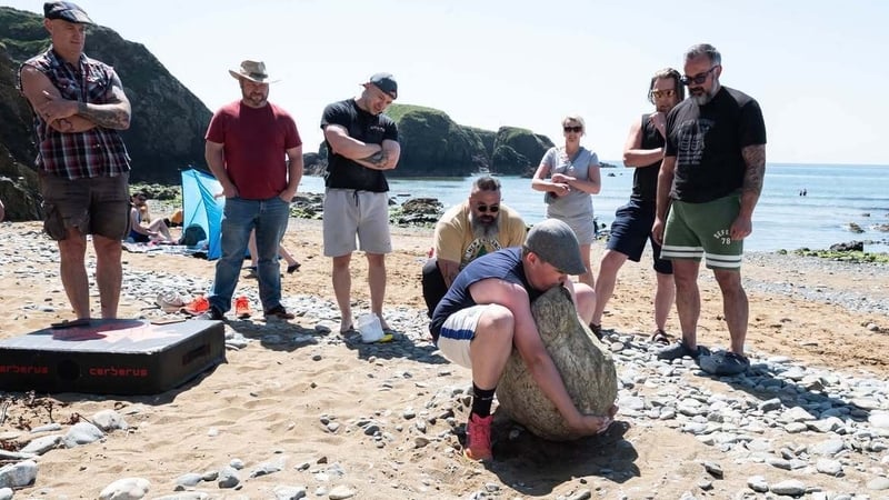 Hup! Stonelifters take turns to lift the Cloch Bán on Annestown beach, Co Waterford in May 2025. Photo: Pat Shanahan https://www.instagram.com/shanahanpat11/