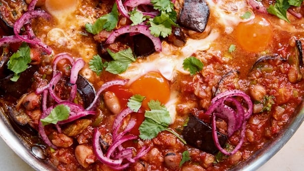 a pot of food with vegetables