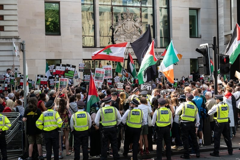 Police attempt to contain the crowd in support of Kneecap at Westminster Magistrates' Court