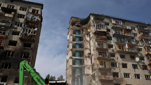 A nine story residential building in the Solomianskyi district of Ukraine is partially destroyed following a Russian missile strike
