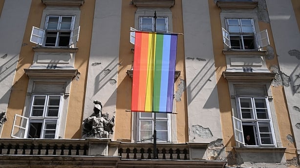 A rainbow flag hangs at the Budapest City Hall on June 6, 2025, a day after a decree signed by Hungarian Prime Minister Viktor Orban prohibited the display of symbols "referring to or promoting" sexual minorities on government buildings. Hungarian Prime Minister Viktor Orban prohibited the display o