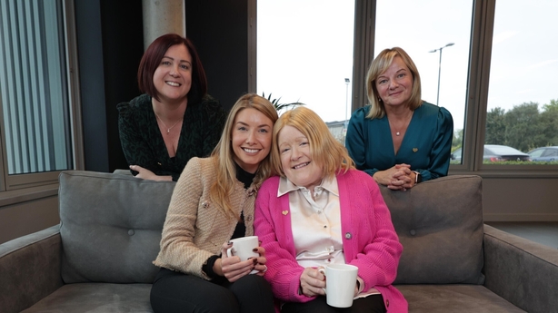 a group of women sitting on a couch