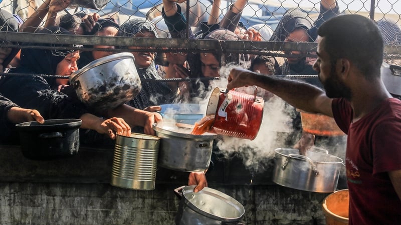 People gathering for food in Khan Younis in June