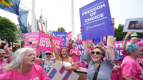 Campaigners in support of the assisted dying bill celebrate in Westminster, central London, after the vote