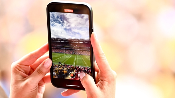 21 July 2024; A spectator records a video before the GAA Hurling All-Ireland Senior Championship Final between Clare and Cork at Croke Park in Dublin. Photo by Piaras Ó Mídheach/Sportsfile