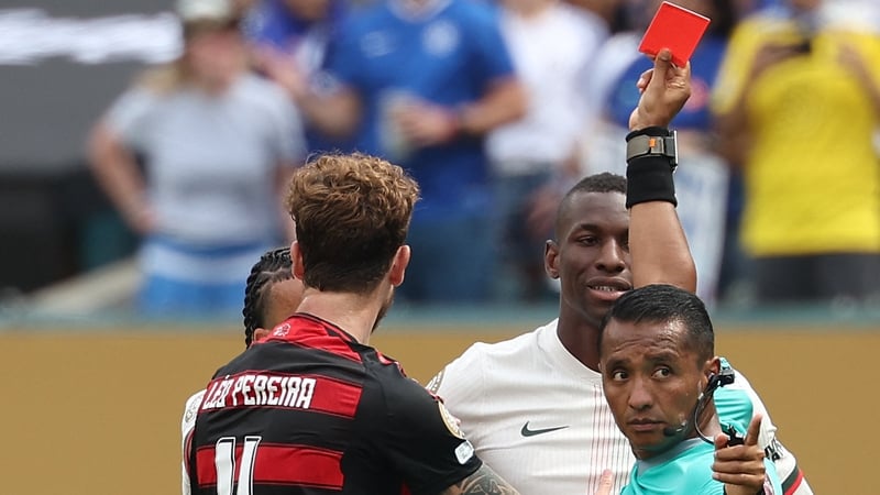 Referee Ivan Barton shows a red card to Chelsea's Nicolas Jackson