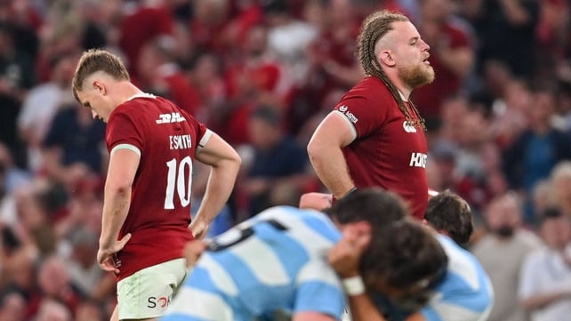 British and Irish Lions pair Fin Smith, left, and Finlay Bealham, react after defeat to Argentina