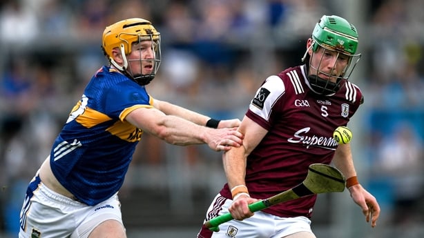 Cianan Fahy of Galway is tackled by Jake Morris of Tipperary during the GAA Hurling All-Ireland Senior Championship quarter-final match between Galway and Tipperary at TUS Gaelic Grounds in Limerick.