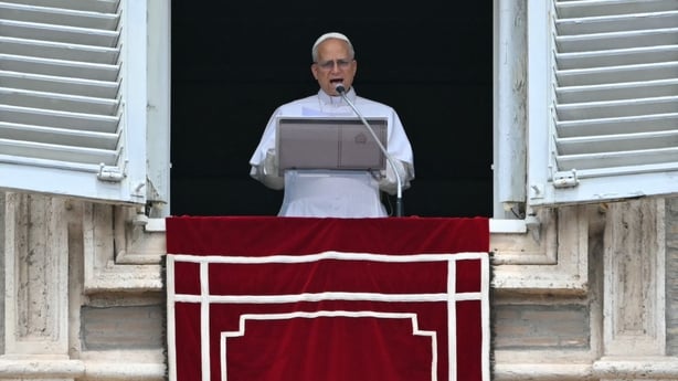 Pope Leo XIV addresses the crowd from the window of the apostolic palace overlooking St. Peter's square during the Angelus prayer in The Vatican on June 22, 2025. (Photo by Andreas SOLARO / AFP)
