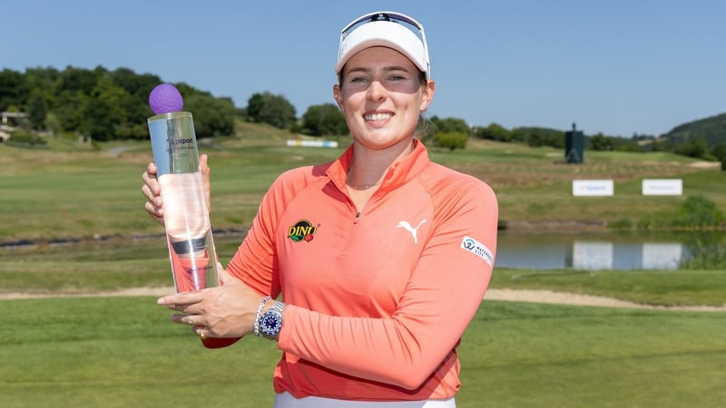 Casandra Alexander holds aloft the winning trophy after a sensational final round at Royal Beroun